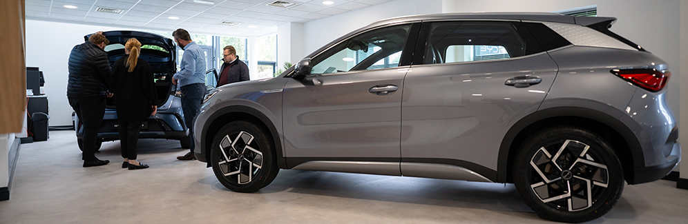 Customers looking at vehicles in BYD showroom