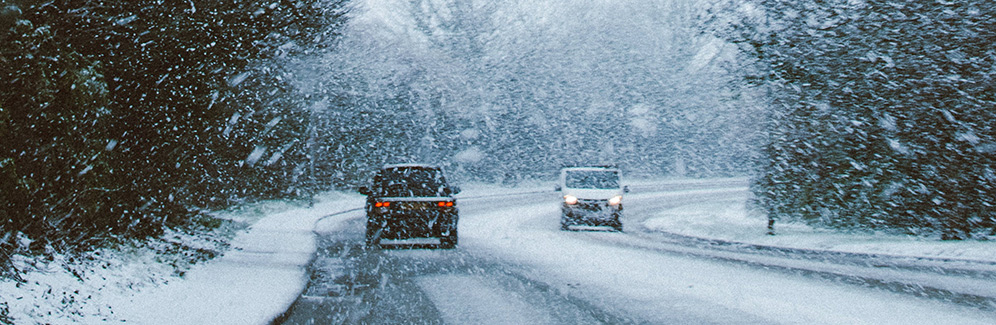 cars driving in snow