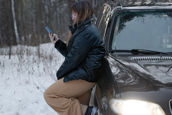 woman-on-phone-outside-car-BYD-car