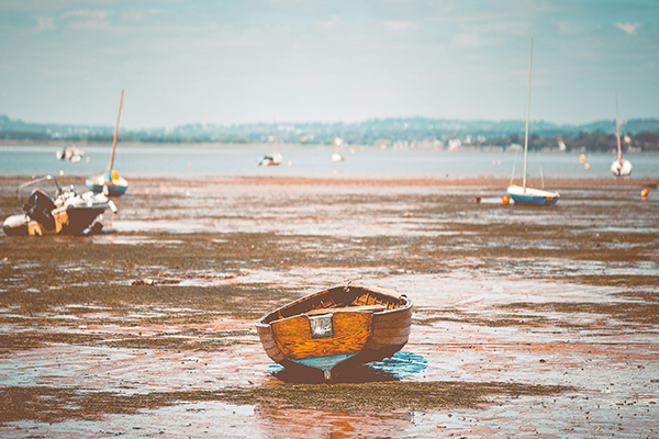 Boat on low tide beach Accessible walks