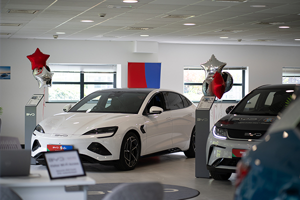 Cars in showroom decorated for the event BYD Dream Weekend Roundup