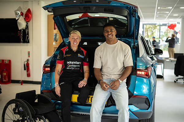 Lexi Chambers and Immanuel Feyi-Waboso sat in boot of BYD ATTO 3.