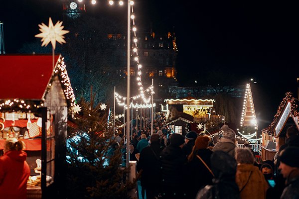 Crowds of people amongst Christmas Market stalls