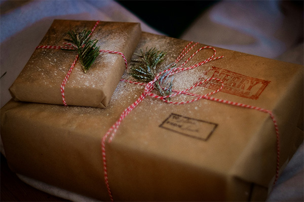 Presents wrapped in brown paper and tied with string