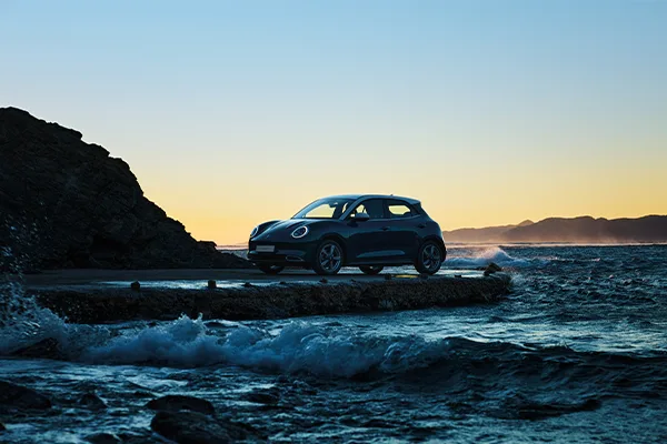 GWM ORA in the sunset next to the ocean
