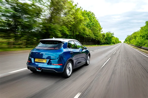 GWM ORA 03 in blue driving away